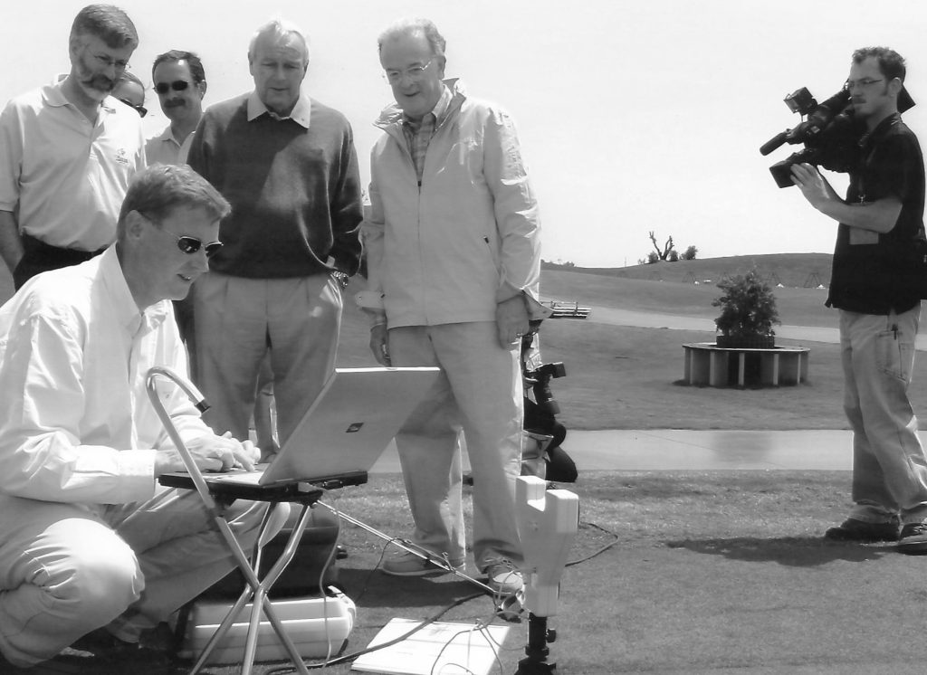 Tony coaching watched by Arnold Palmer and President Jorge Sampaio